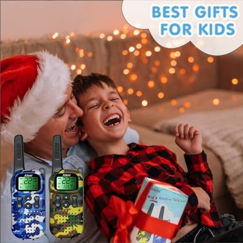 Father and son laughing with walkie-talkies, Christmas theme.